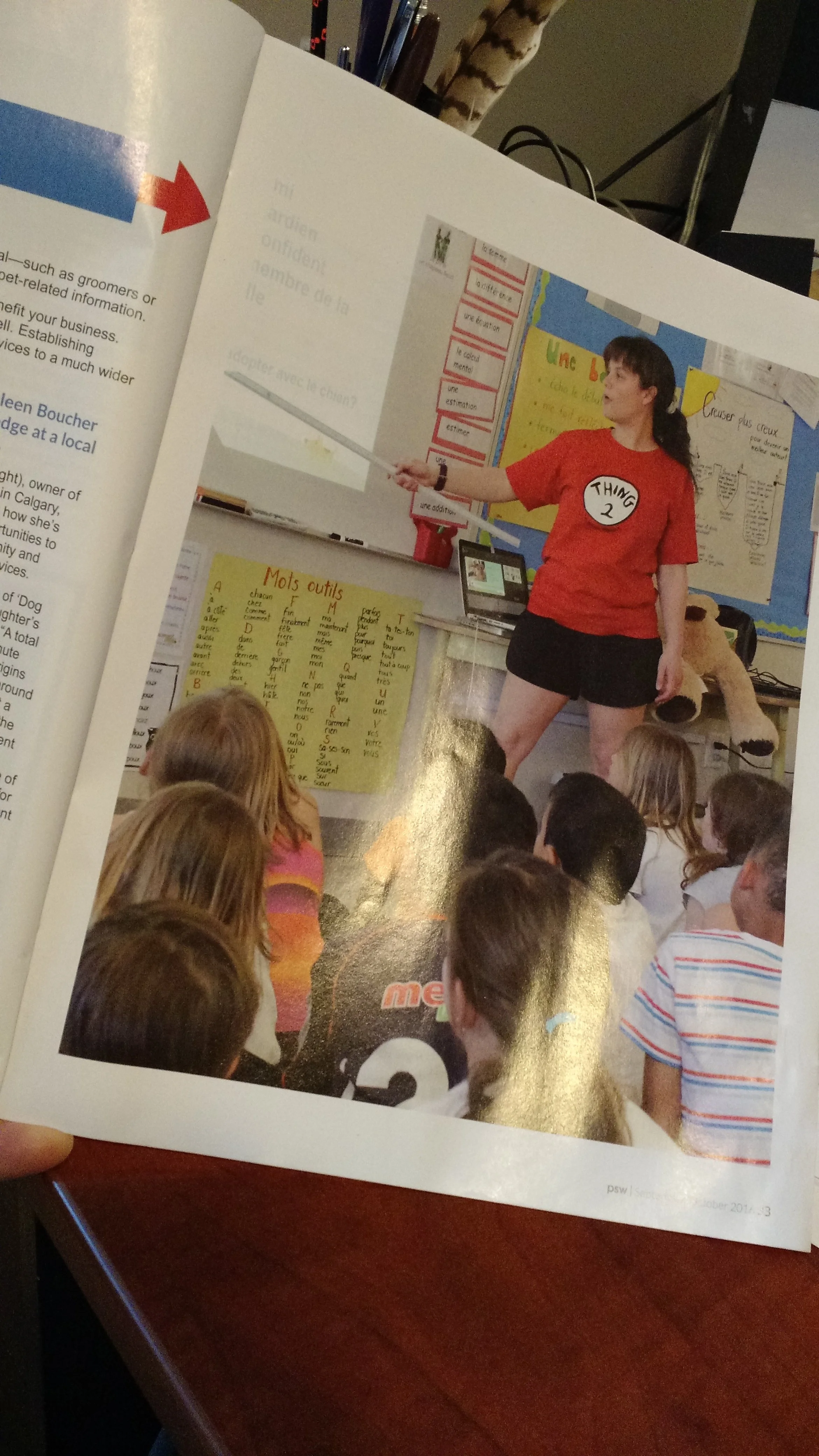A photo of the owner of Le Chat Savant French Tutoring teaching Dog Safety to elementary school students