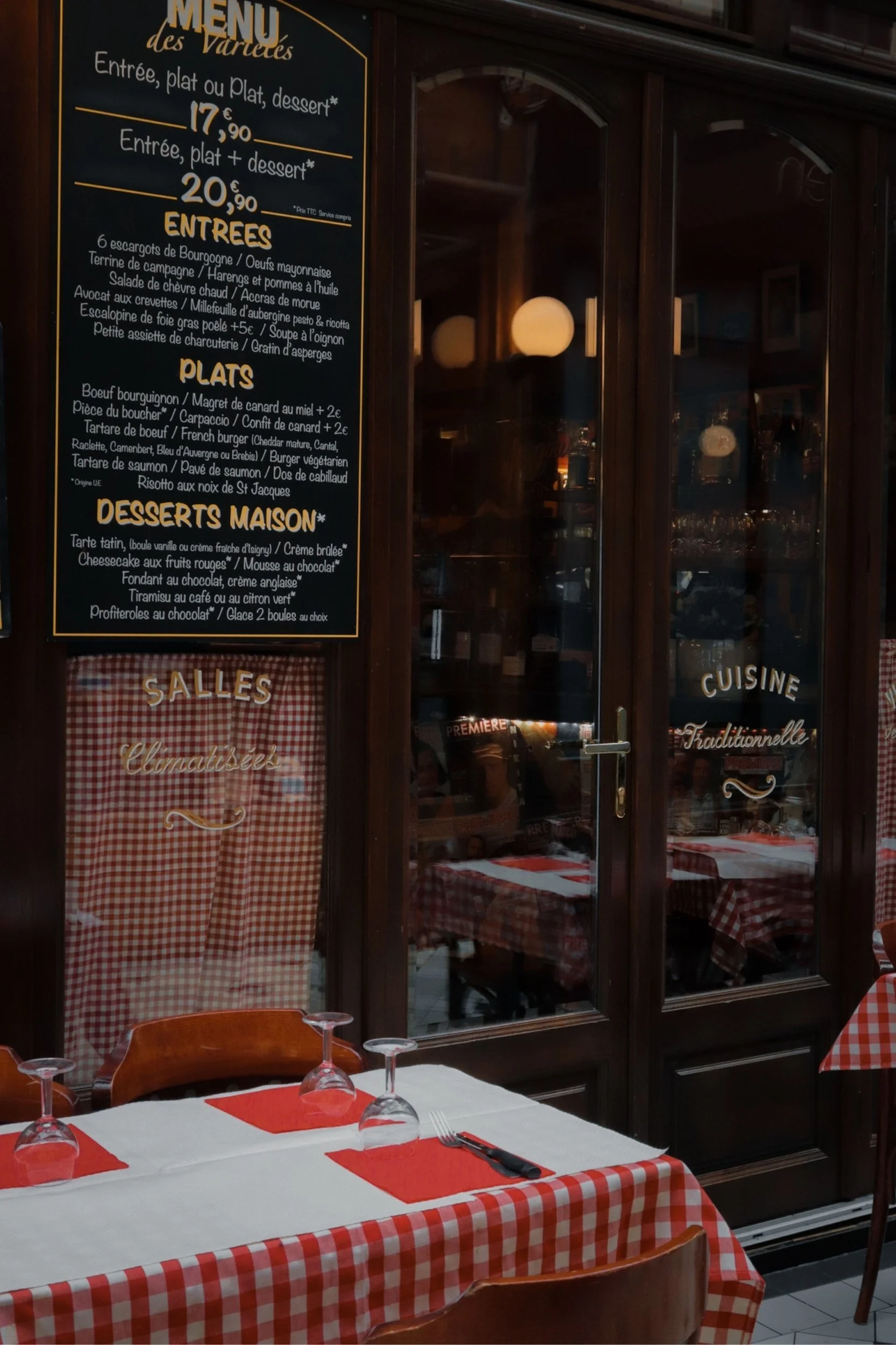The menu of a french restaurant on the wall