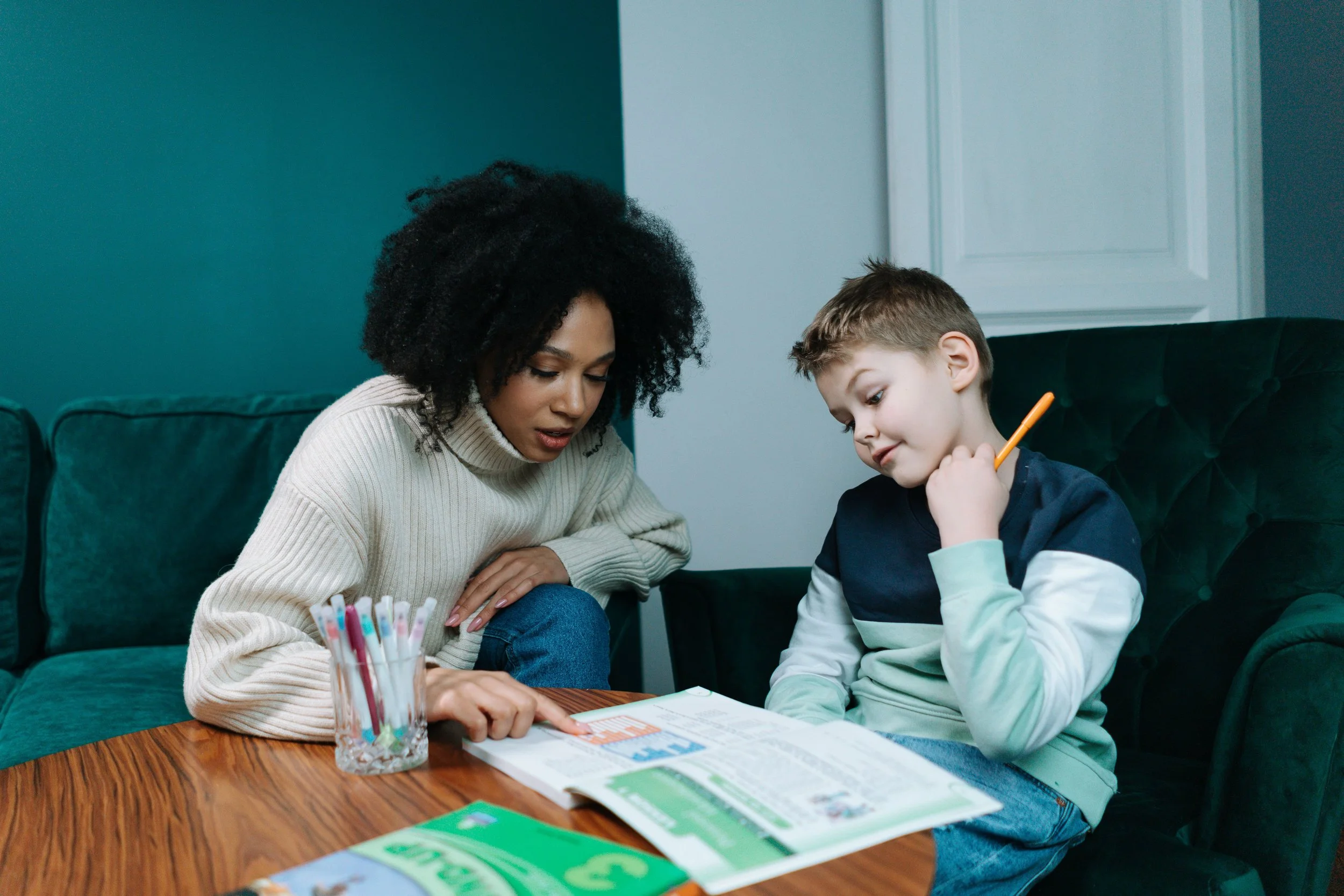A young bog and a tutor working on a table