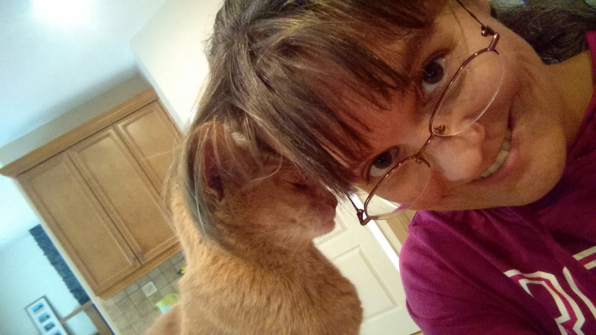 Kathleen with an orange cat