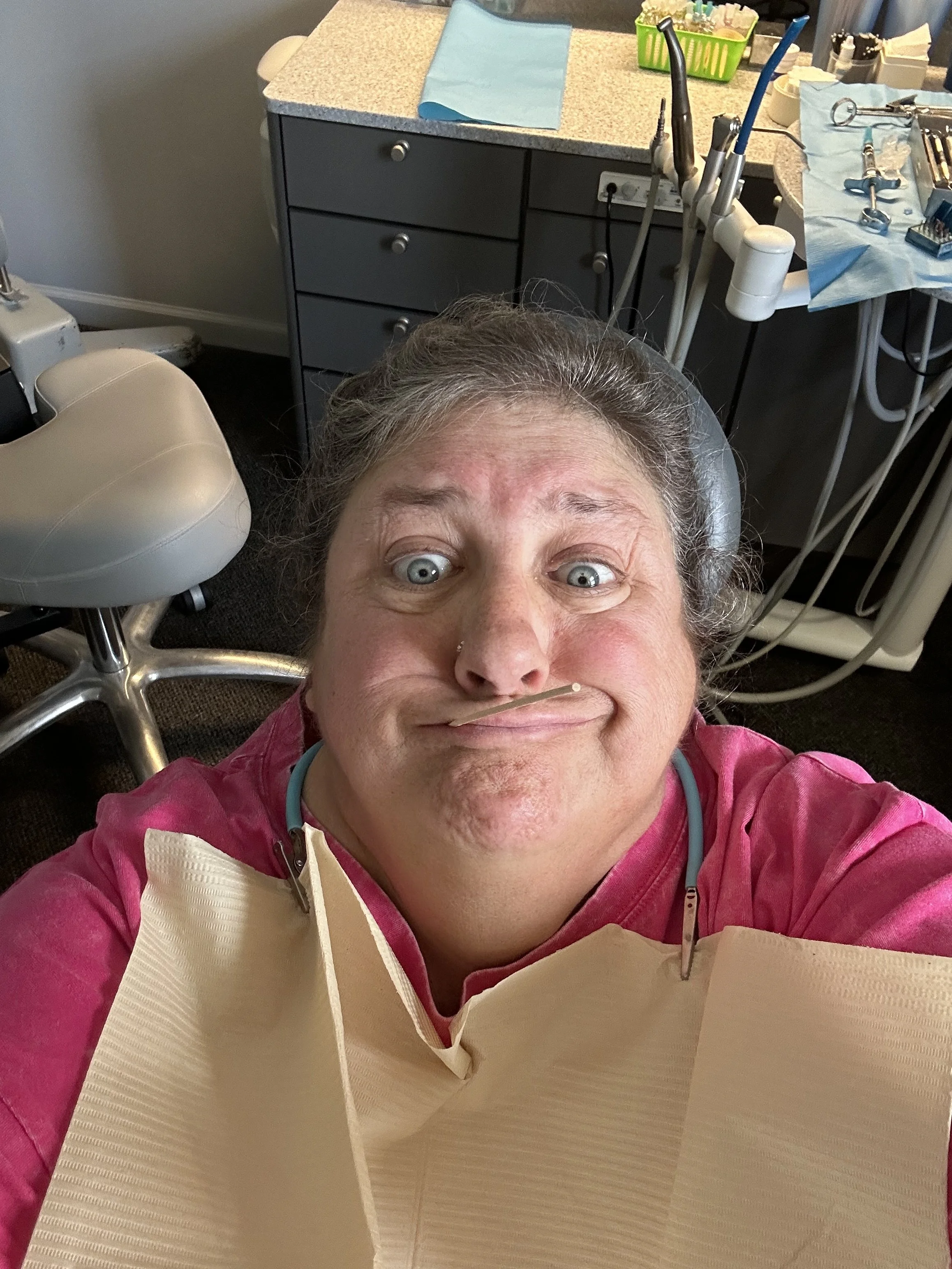 Wynne waits for the dentist to get her tooth fixed before her trip.