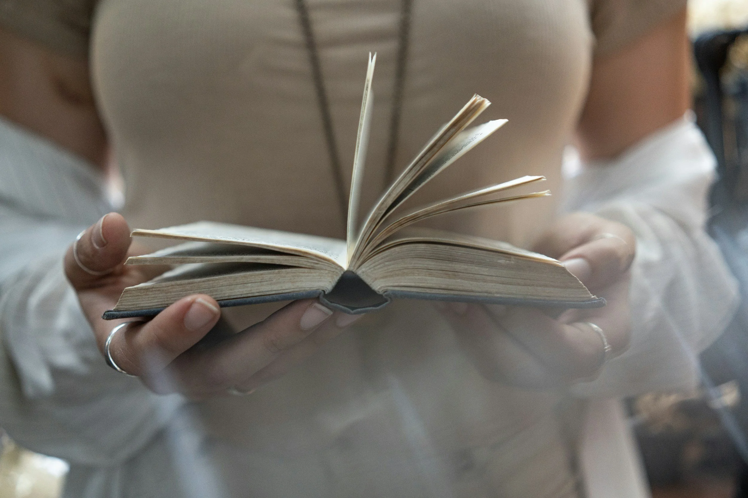 Reader holding an open book