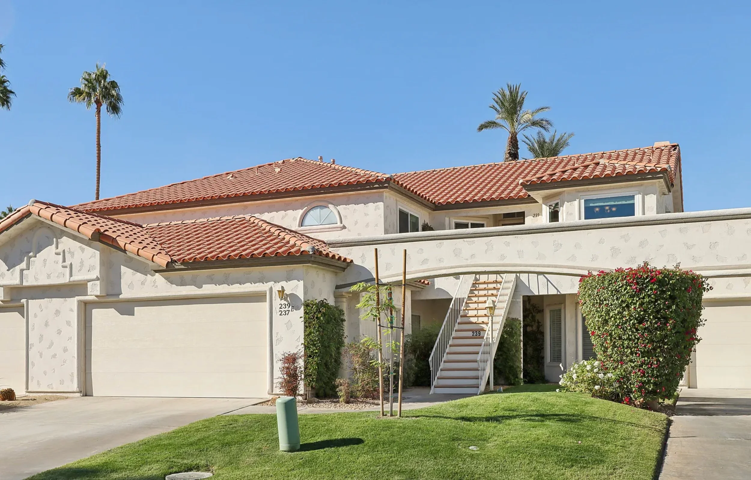 Front of the condo, driveway to the left, upstairs unit