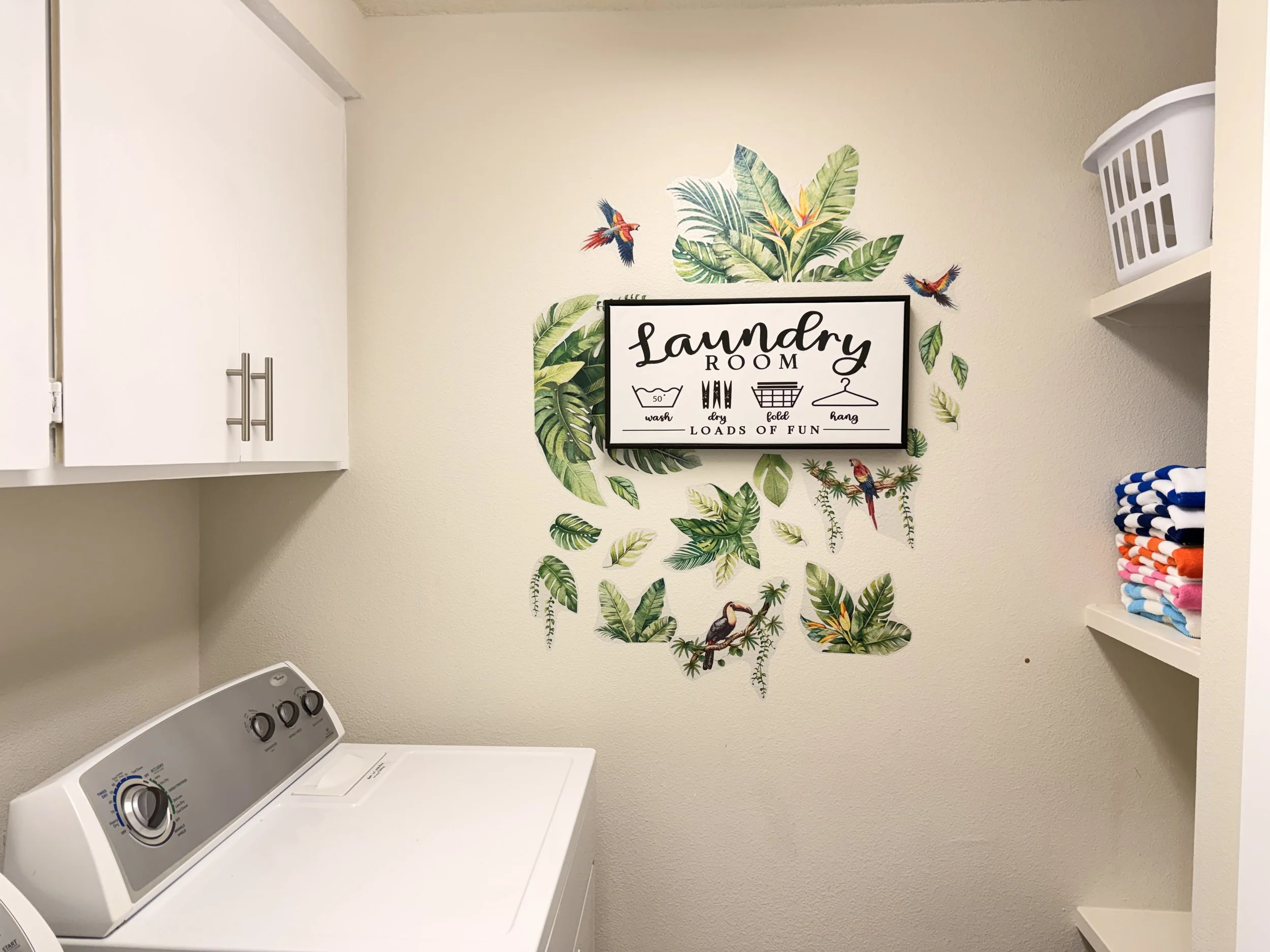 Laundry room with washer and dryer, pool towels