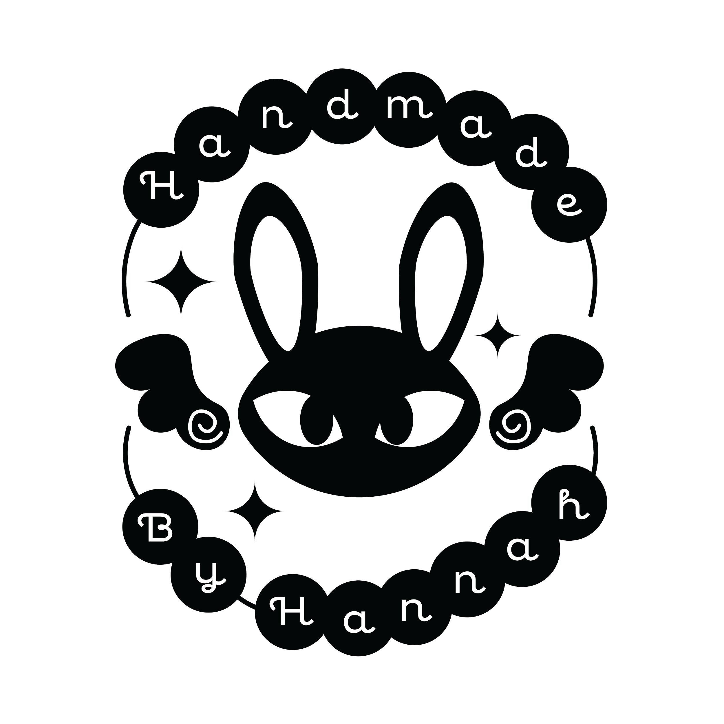 An all black logo that has an image of a rabbit in the center with wings on both sides. At the top reads handmade inside of an image of a friendship bracelet and the bottom reads by hannah, also in an image of a friendship bracelet