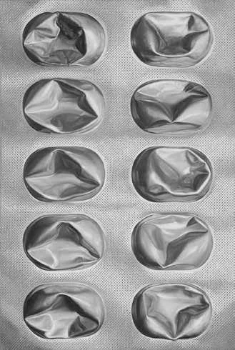 Eight empty silver foil cupcake liners arranged in four rows of two on a textured surface.