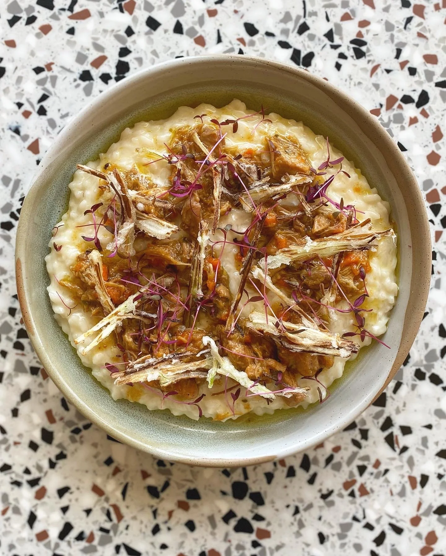 Slow-cooked rabbit risotto with leek tempura, prepared in a Perth home kitchen