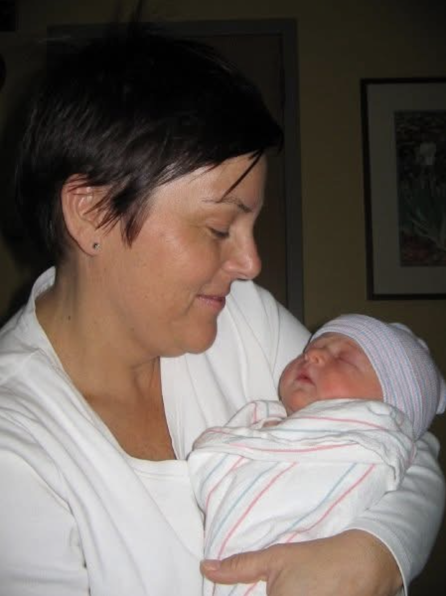 The founder holding her newborn daughter, Daisy Marie, named after her Grandma Marie.