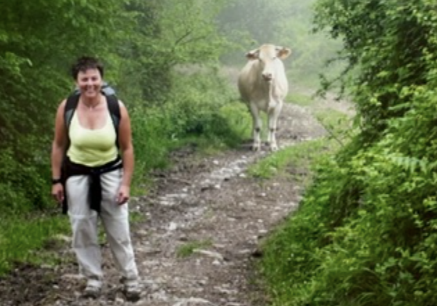The founder walking on a trail in the Pyrenees Mountains during her life coaching training in France.