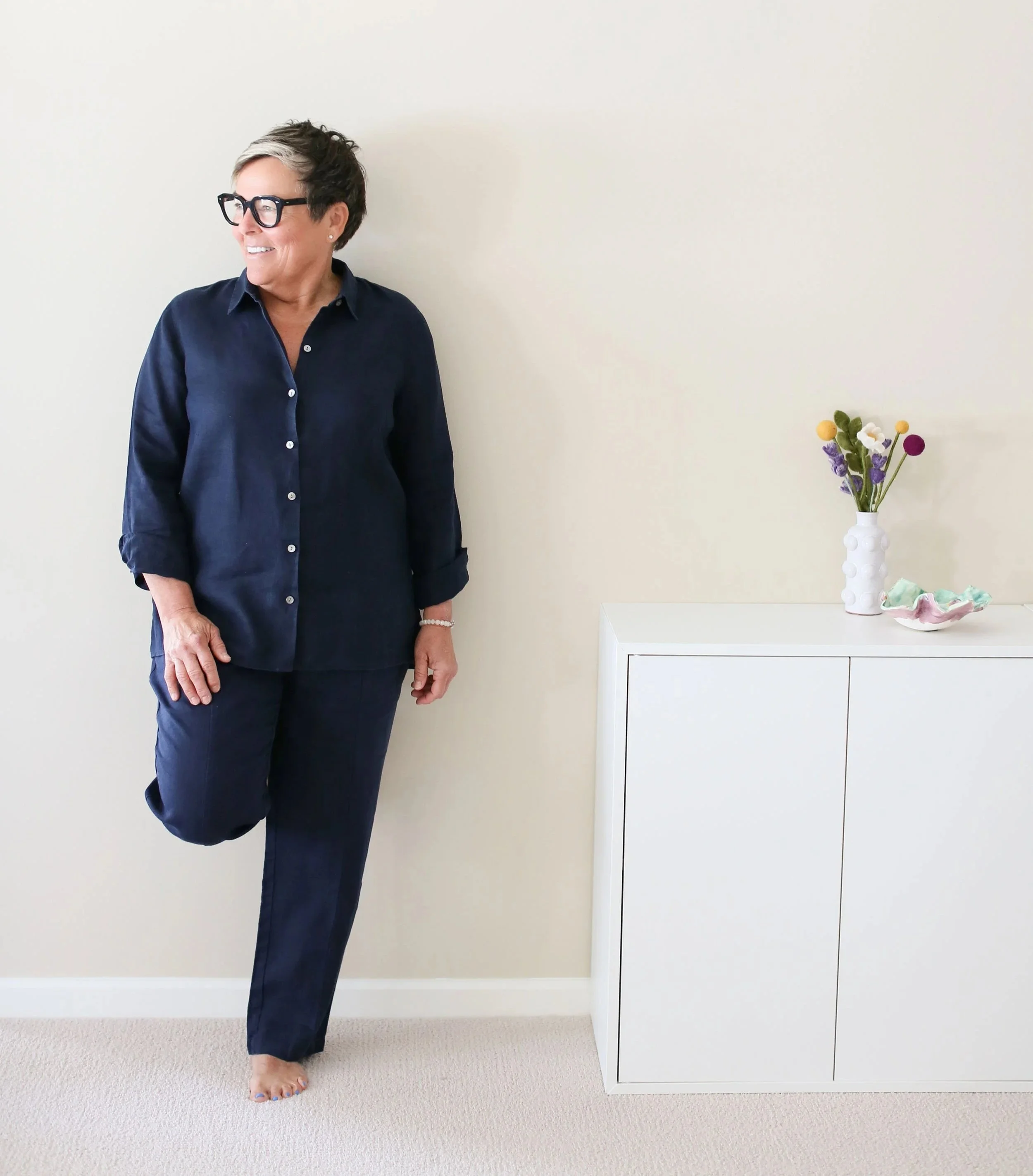 Michelle, professional decluttering and organizing consultant for women in midlife, standing in a calm, organized home