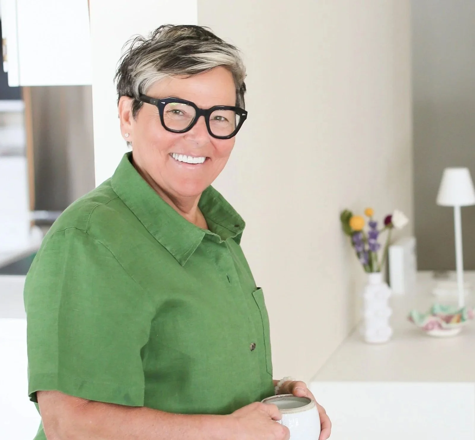 Michelle, professional decluttering and organizing consultant, smiling in her home