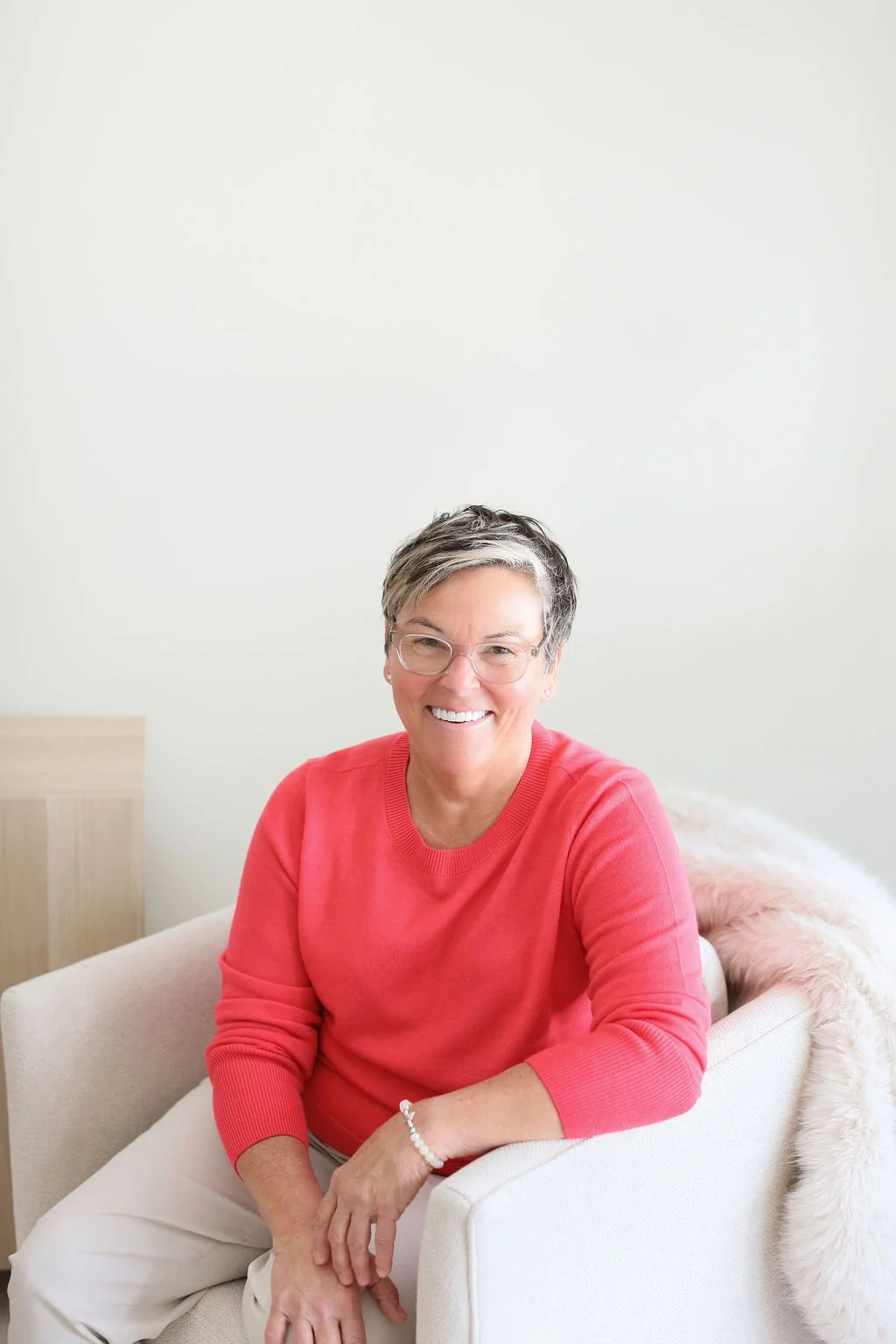 Michelle Hoff, compassionate decluttering coach, smiling in a calm home