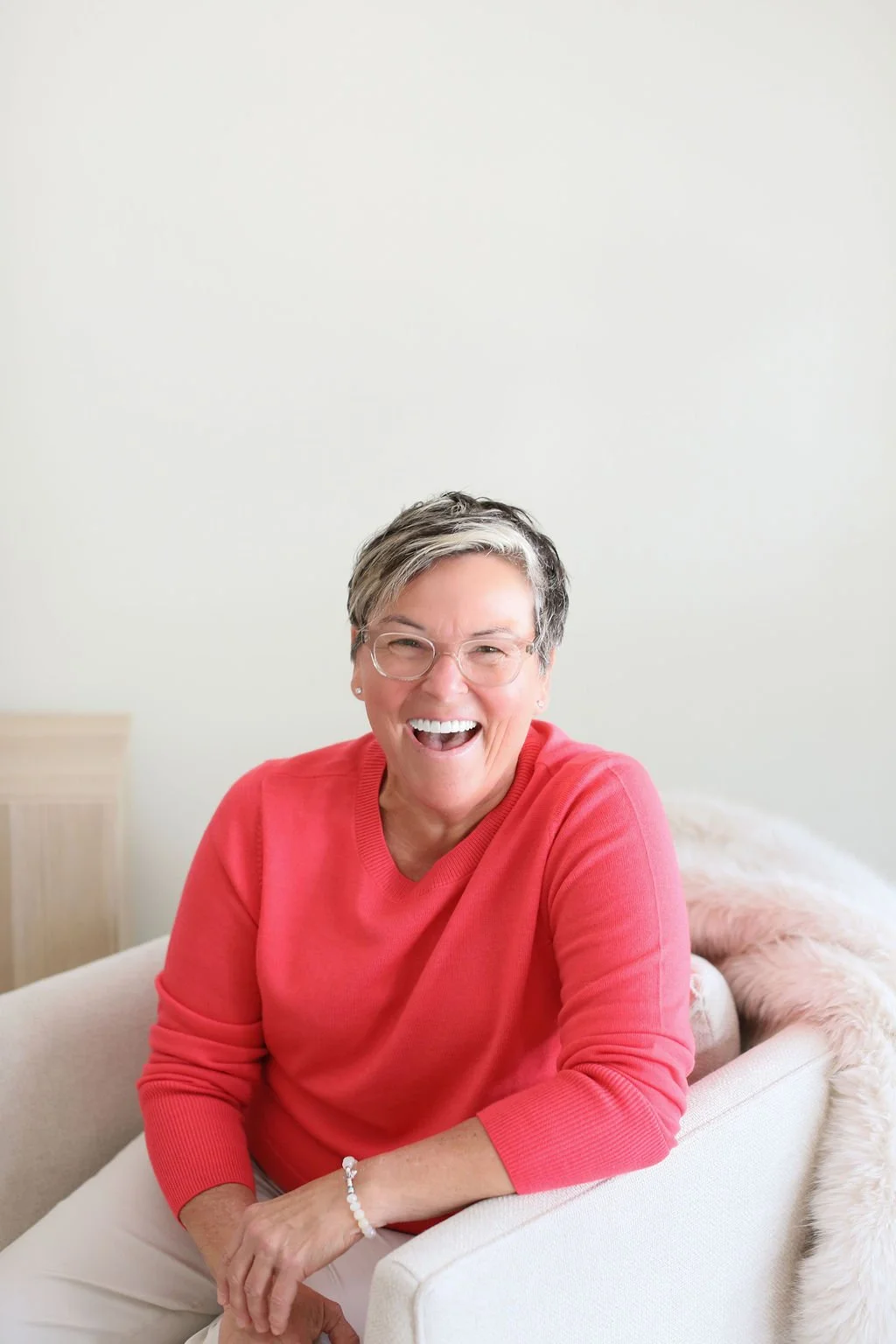 Michelle, professional decluttering and organizing consultant for women in midlife, smiling at home