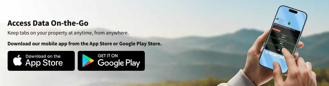 A person holding a smartphone showing a property monitoring app, with mountains in the background and download buttons for the App Store and Google Play Store.