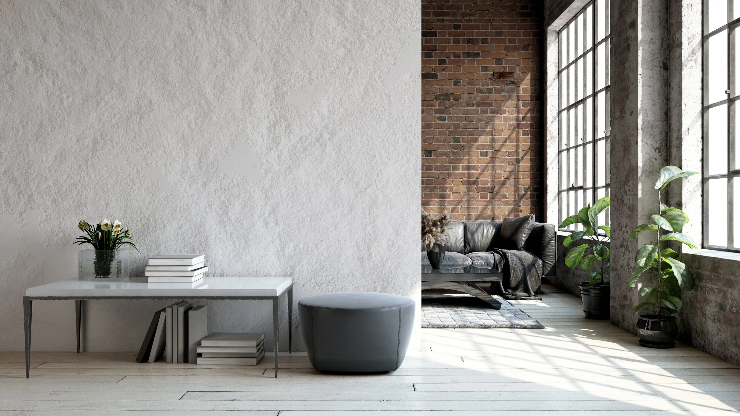 Modern interior with white textured wall, small table with flowers and books, and a living area with large windows, brick wall, plants, and sofa.