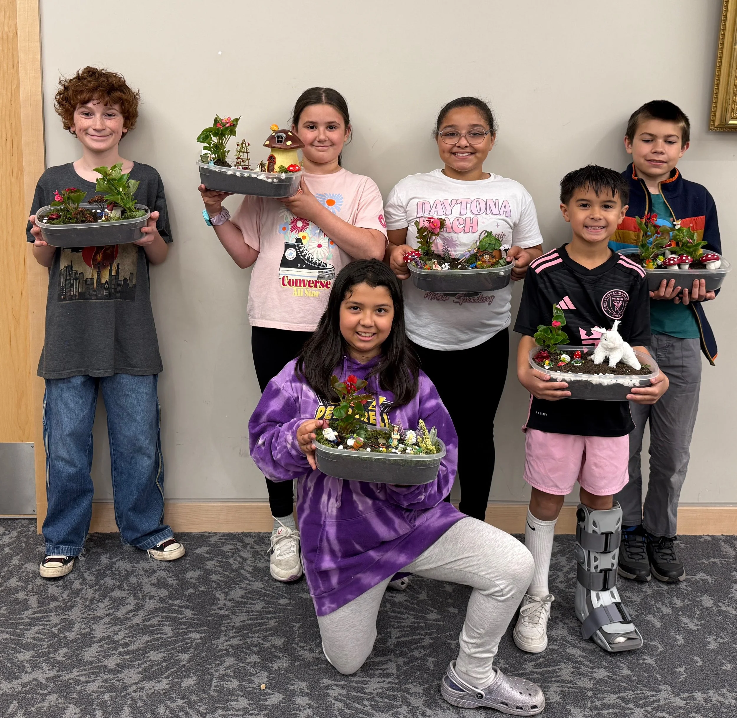Children holding decorations they crafted