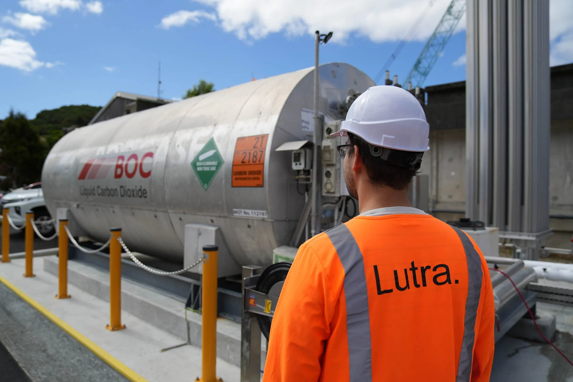 A Lutra Water Engineer stood in front of a Carbon Dioxide tank.