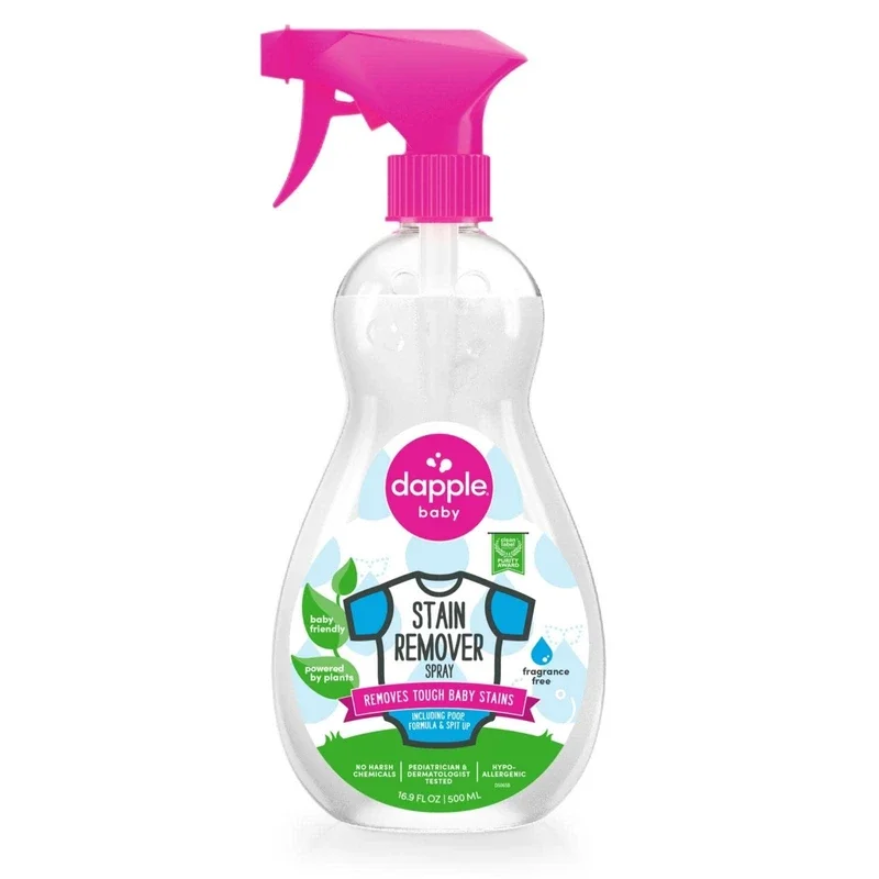 A spray bottle of Dapple Baby Stain Remover with a pink spray top and label indicating it is fragrance free, baby friendly, and designed to remove tough baby stains.