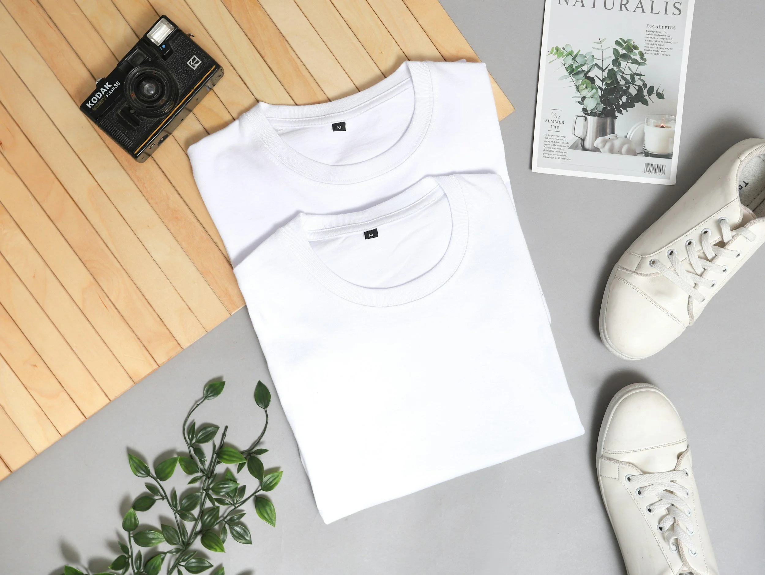Blank white t-shirts for custom printing by Inkstyles & Threads, flat lay apparel mockup.