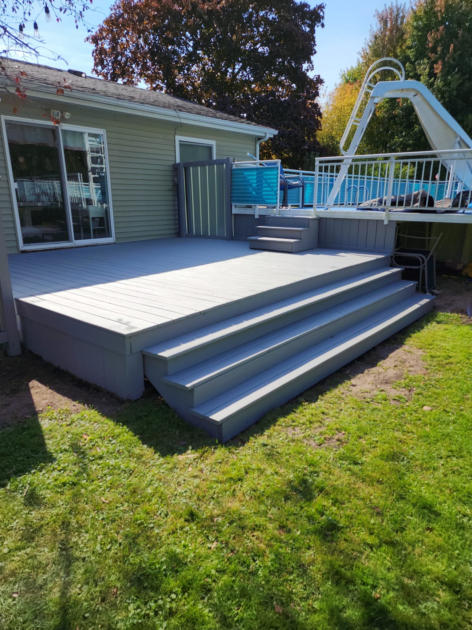 Finished deck restoration with new stairs & fresh paint by Quality Craftsman Services Port Sanilac MI