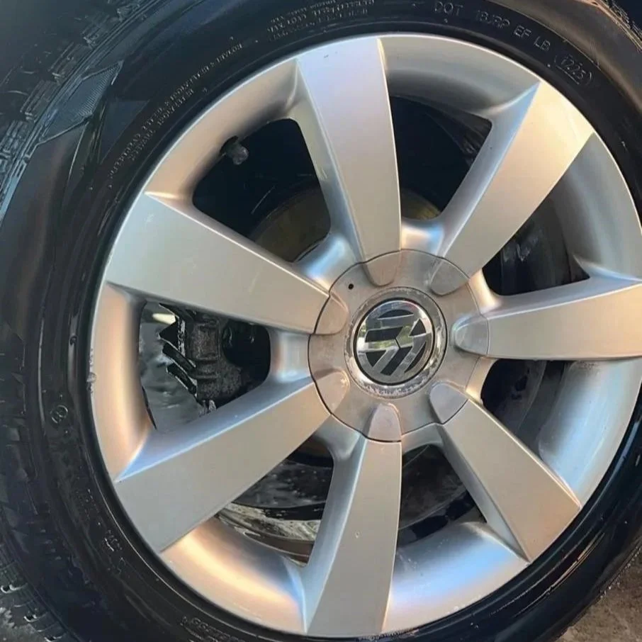 Clean alloy wheel after professional detailing with brake dust removed and a restored finish