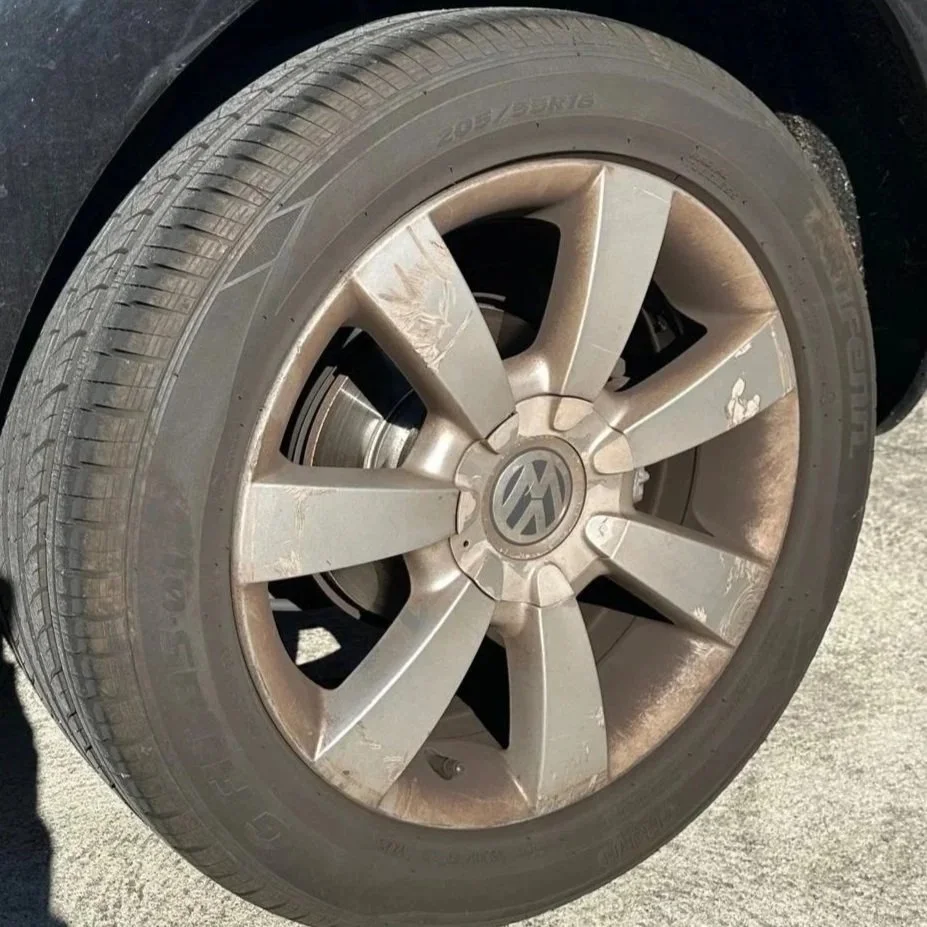 Heavily soiled alloy wheel covered in brake dust before professional wheel detailing