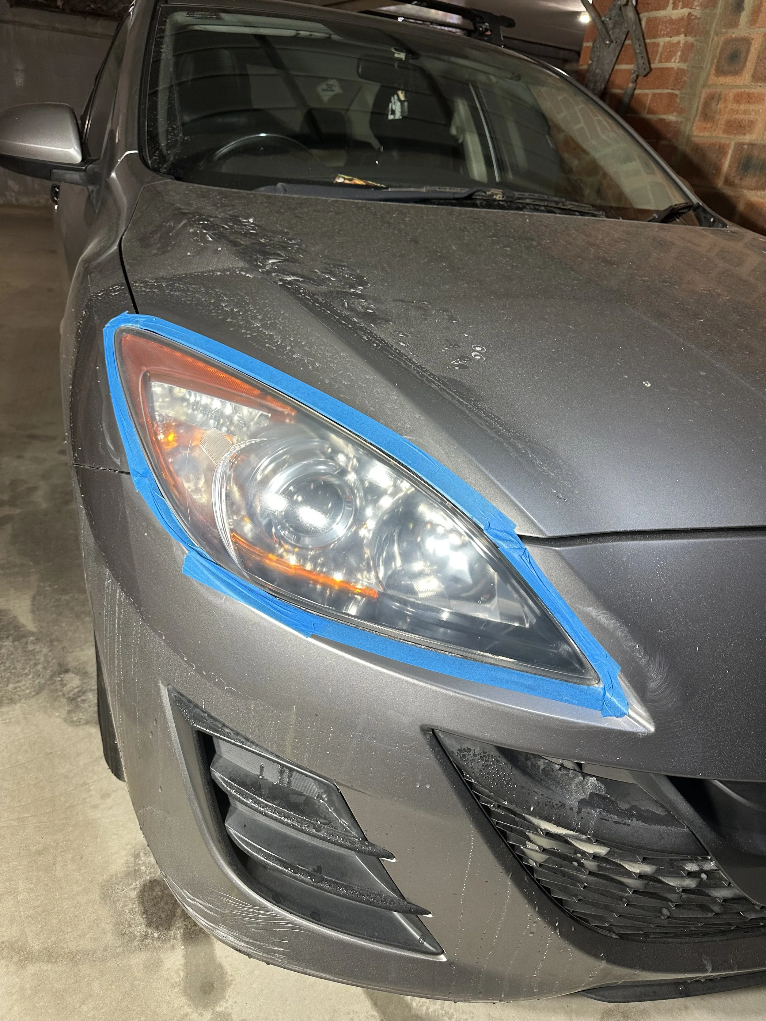 Headlight after restoration showing improved clarity and brightness, removing haze and oxidation for a clear, polished finish.