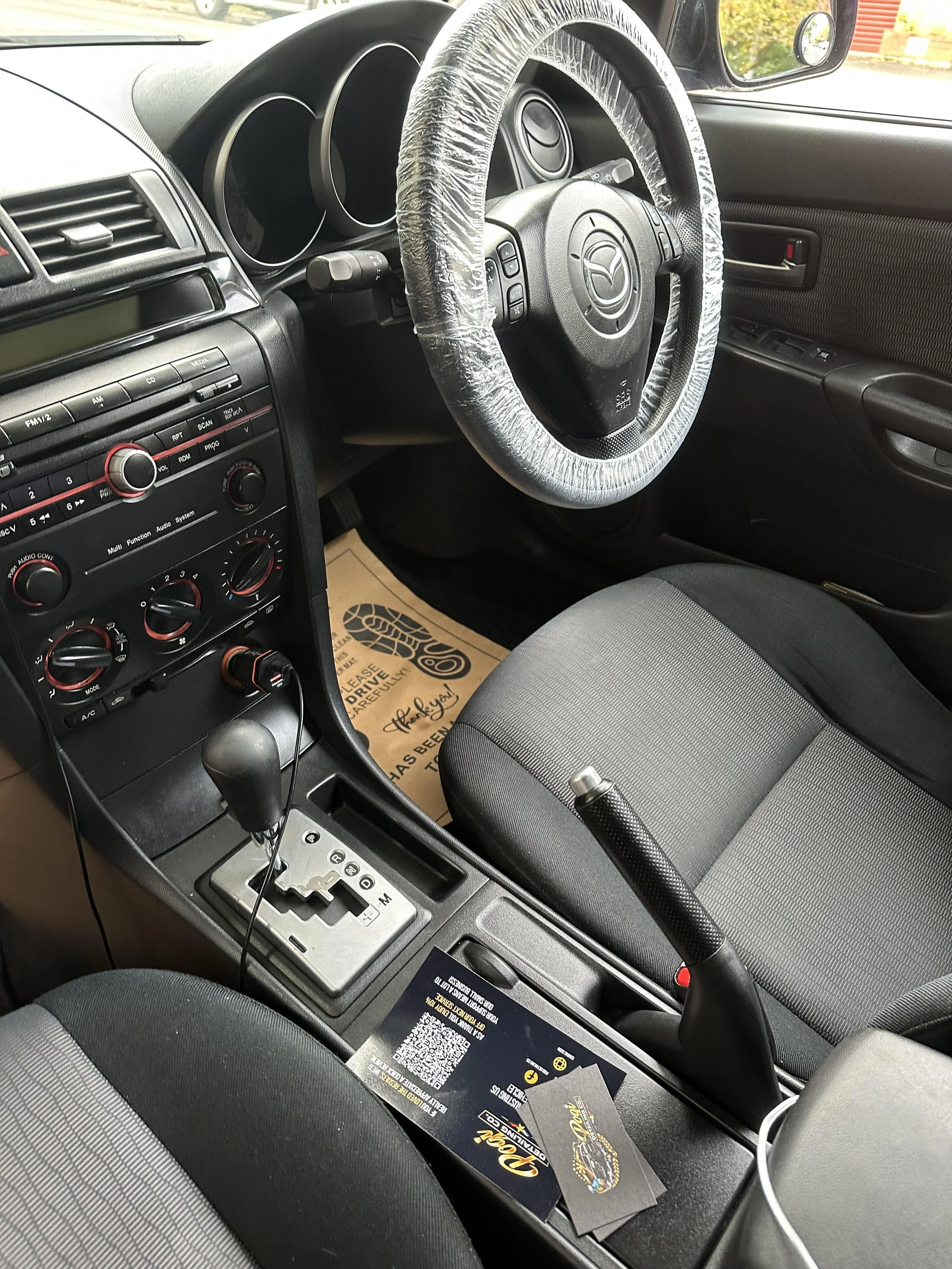 Mercedes AMG interior after professional detailing, showing a clean, refreshed cabin with vacuumed seats and spotless surfaces.