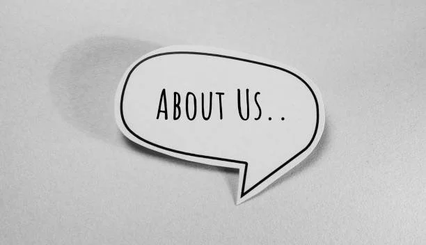 Speech bubble with the words 'ABOUT US..' on a gray background.