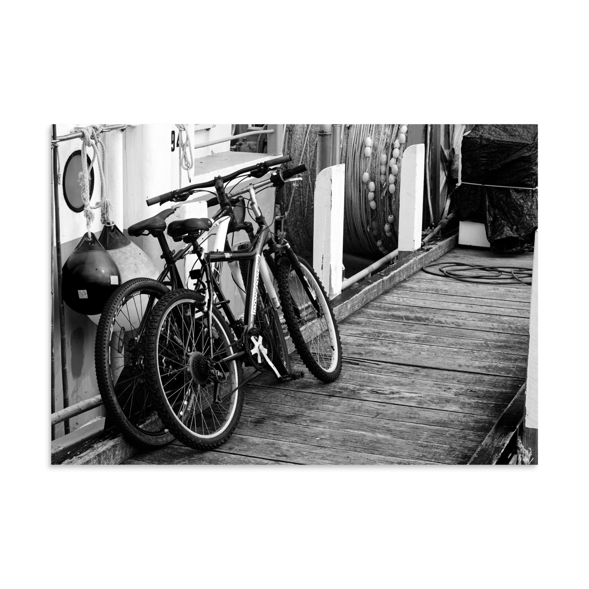 Black and white image of two bicycles used by the fisherman to get around the docks.