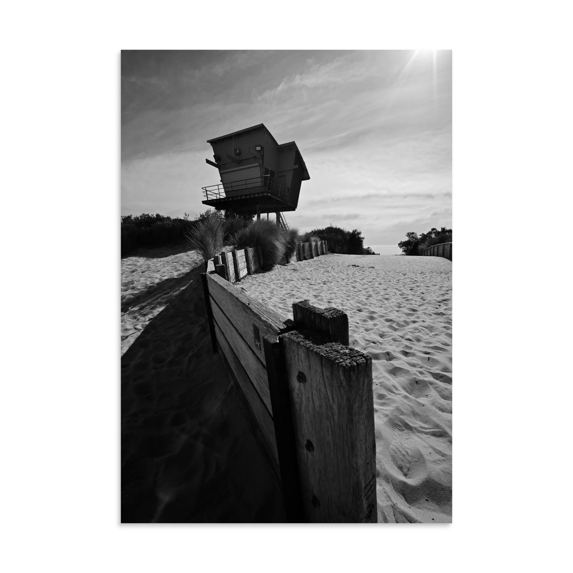 Cool black and white photograph of the lifeguard tower on the 90 mile beach at Lakes Entrance.