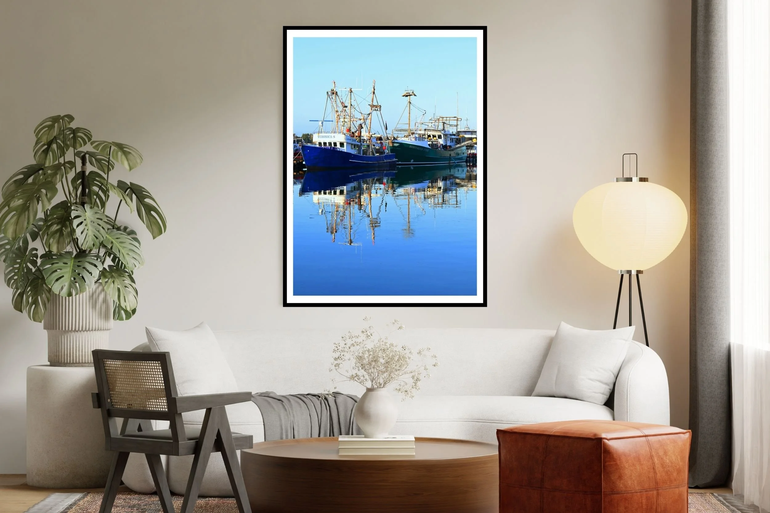 A serene sunlit harbour scene featuring fishing boats and mirror-like reflections on calm water. at the port of Lakes Entrance, Victoria Australia
