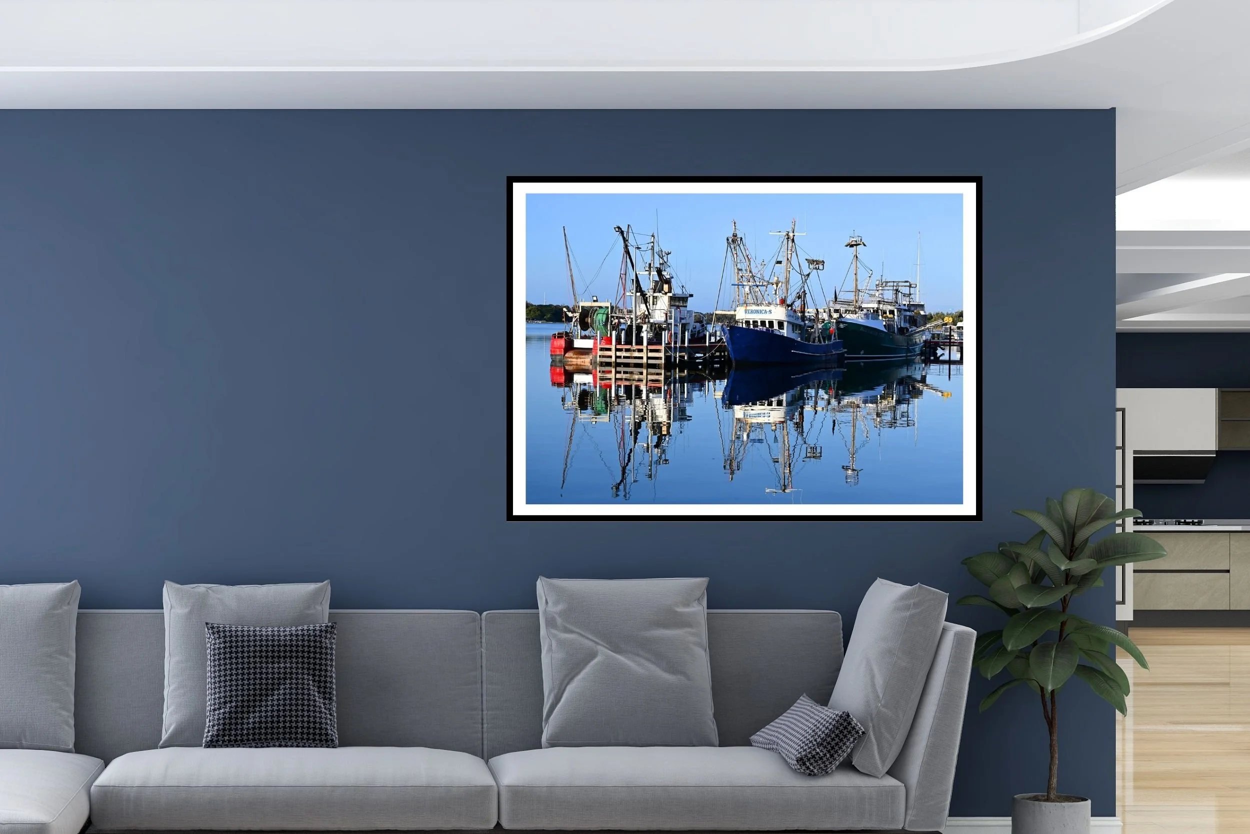 A serene sunlit harbour scene featuring fishing boats and mirror-like reflections on calm water at Lakes Entrance, Victoria Australia.
