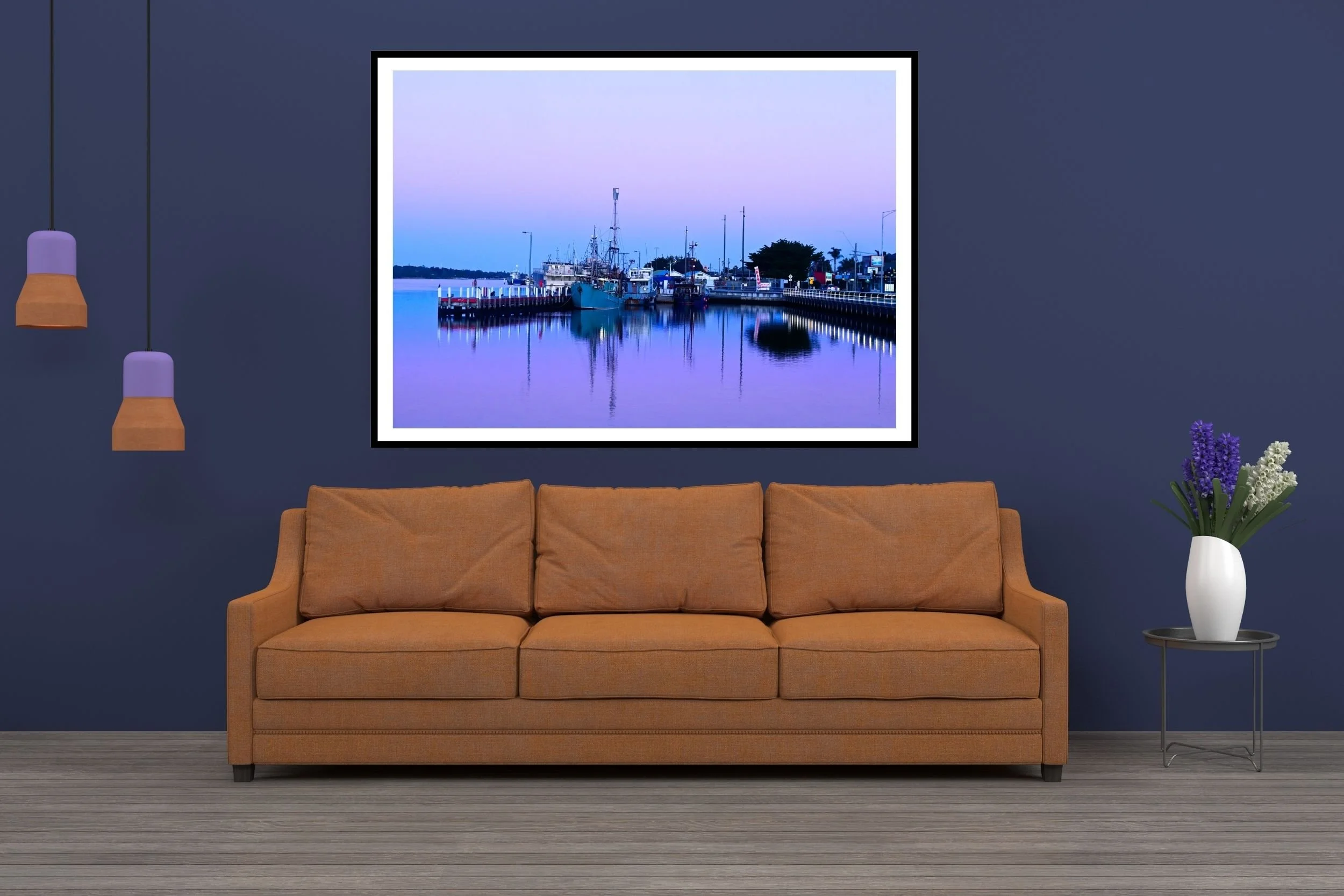 A serene blue hour harbour scene featuring fishing boats and mirror-like reflections on calm water in Lakes Entrance Australia.
