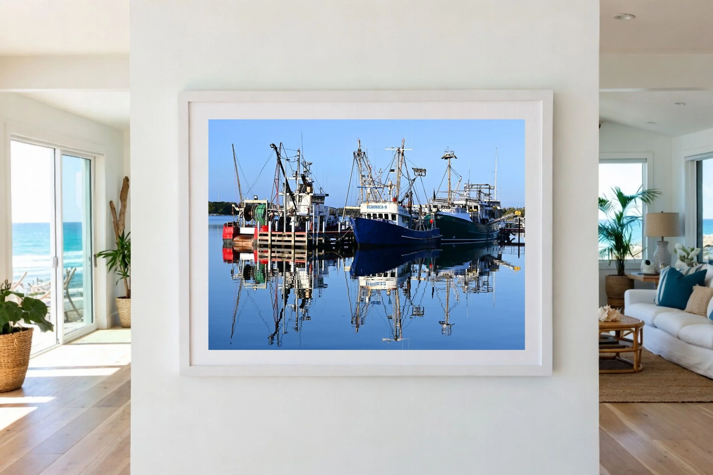 A serene sunlit harbour scene featuring fishing boats and mirror-like reflections on calm water at Lakes Entrance, Victoria Australia.