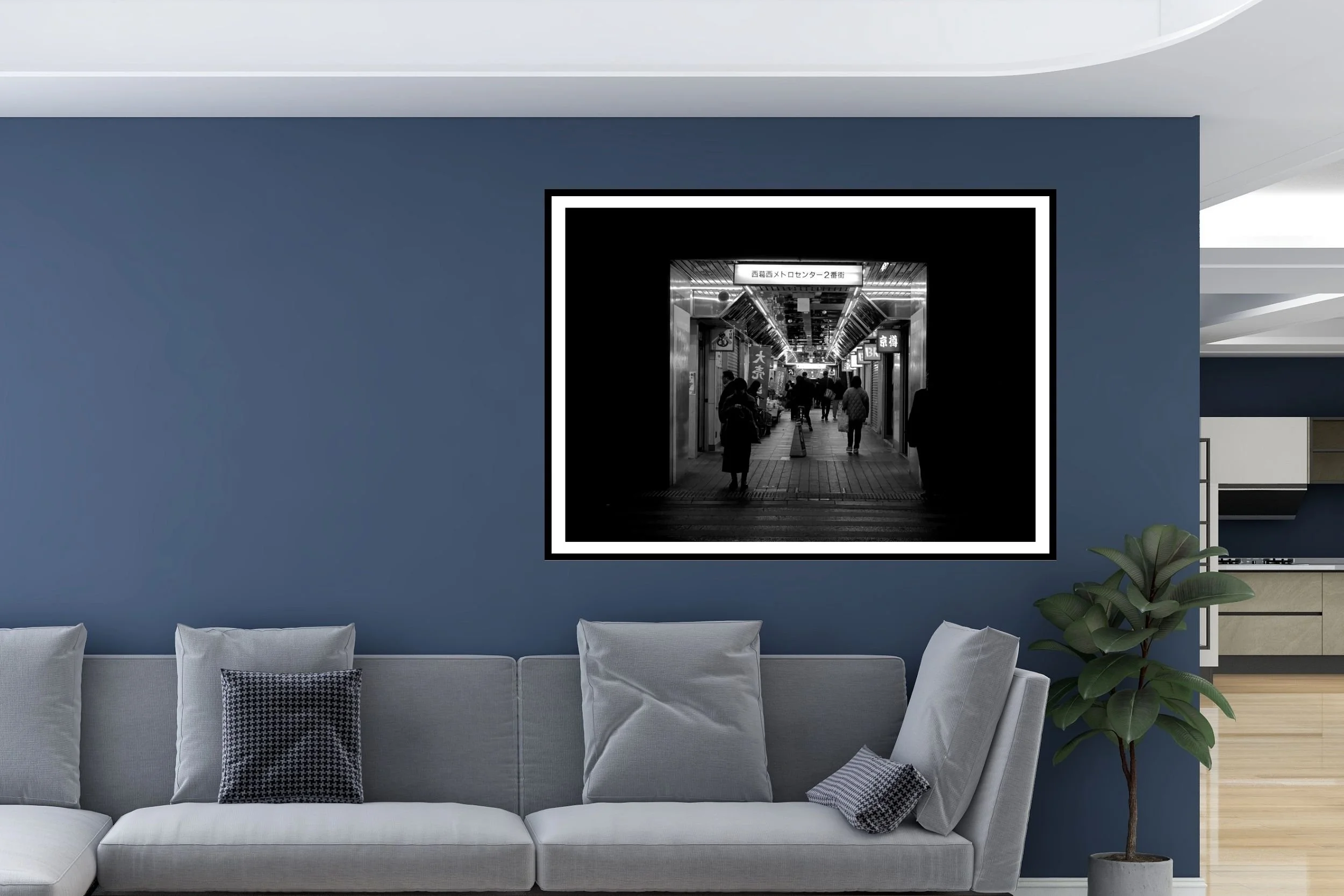 Black and white street photo of shoppers waiting at the dark end of a shopping strip in Nishikasai in Tokyo