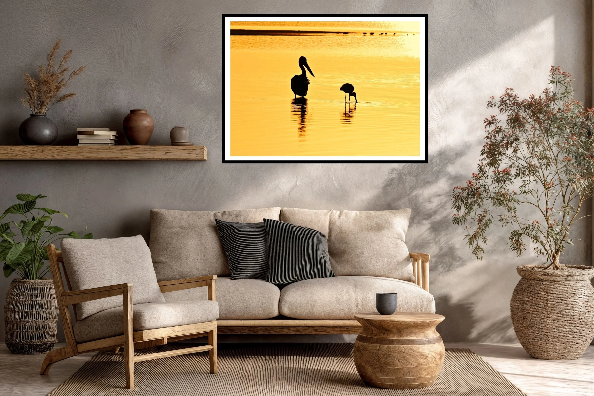 Two Australian native birds (pelican & spoonbill) silhouetted against the lake waters in the morning golden-hour at Lake Tyers, Victoria Australia.