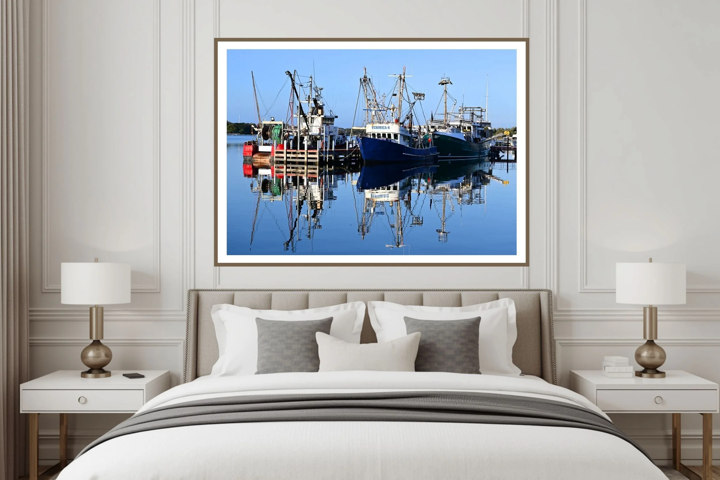 A serene sunlit harbour scene featuring fishing boats and mirror-like reflections on calm water at Lakes Entrance, Victoria Australia.