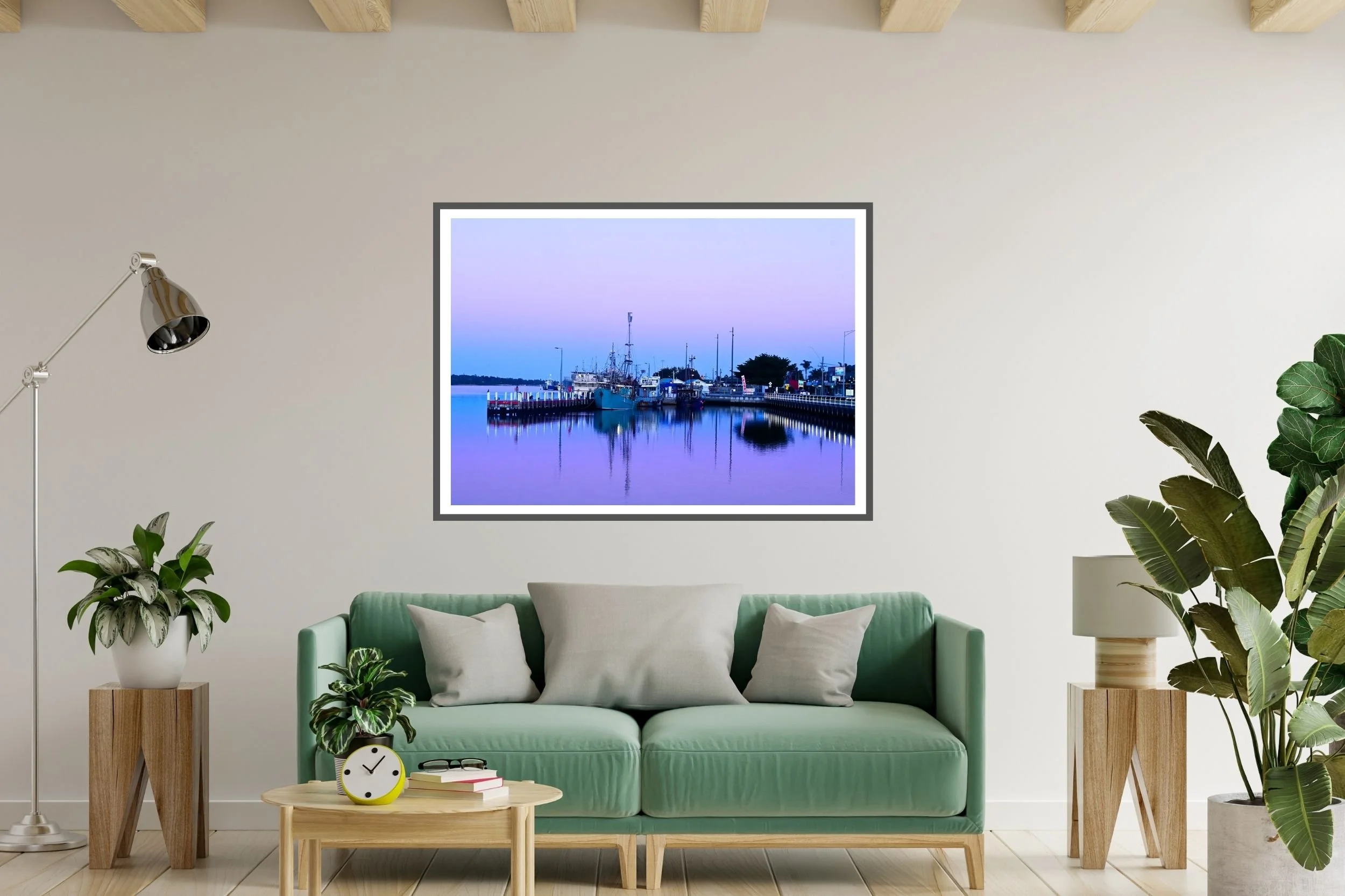 A serene blue hour harbour scene featuring fishing boats and mirror-like reflections on calm water in Lakes Entrance Australia.