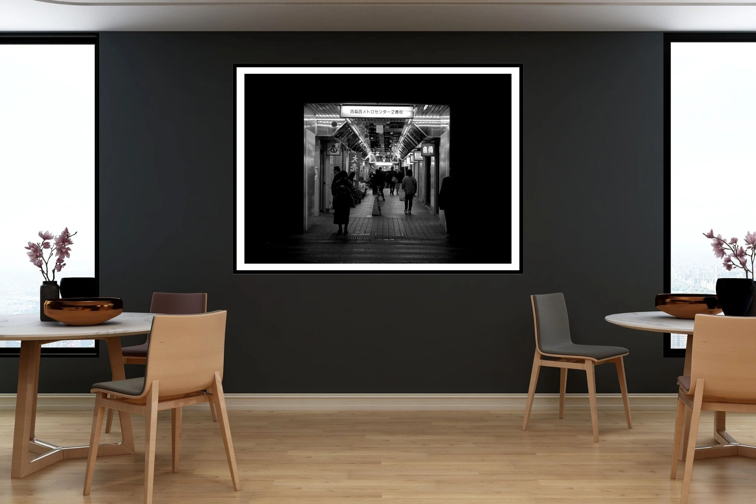 Black and white street photo of shoppers waiting at the dark end of a shopping strip in Nishikasai in Tokyo