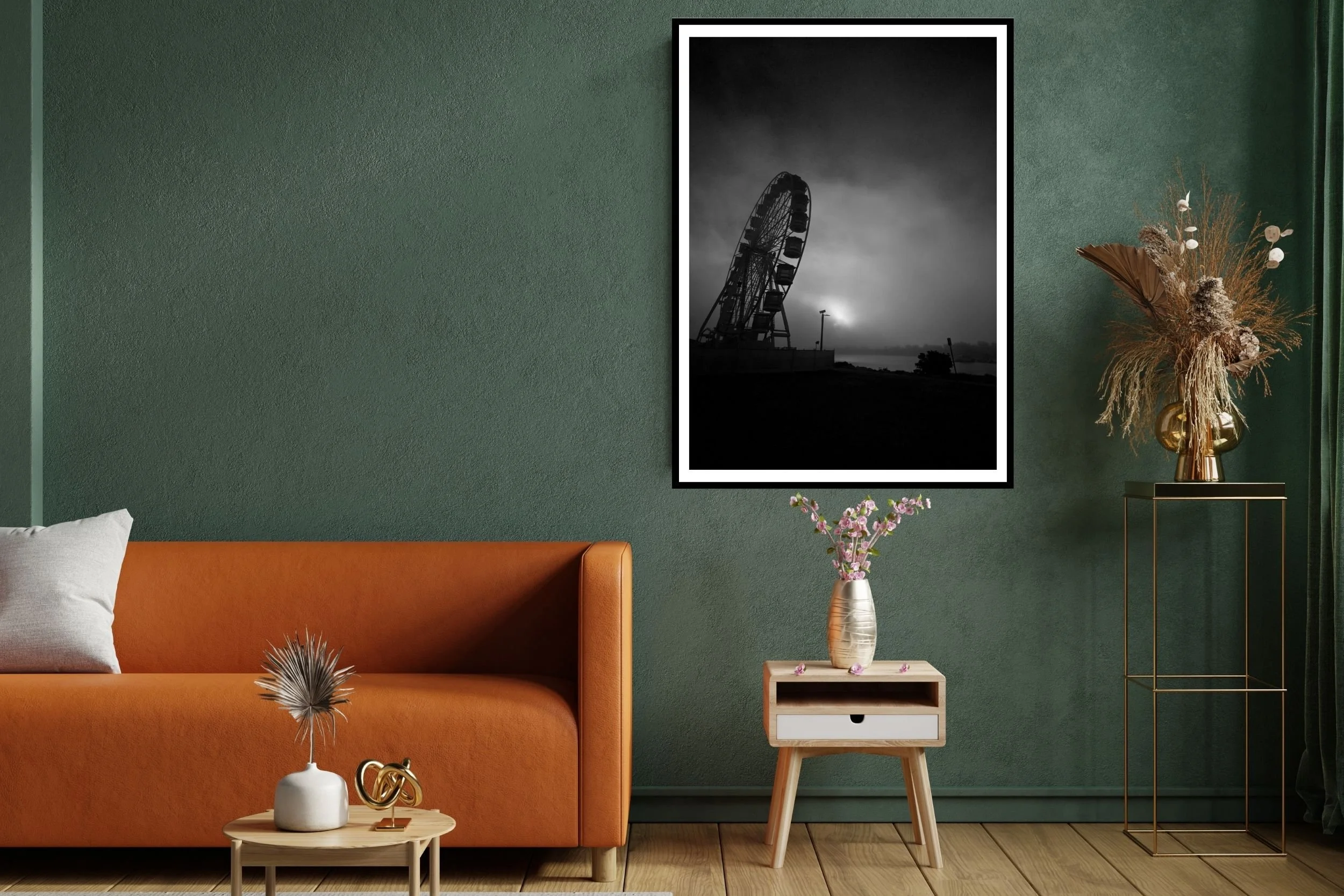 A striking black and white photograph of a carnival ferris wheel set against a morning fog background.