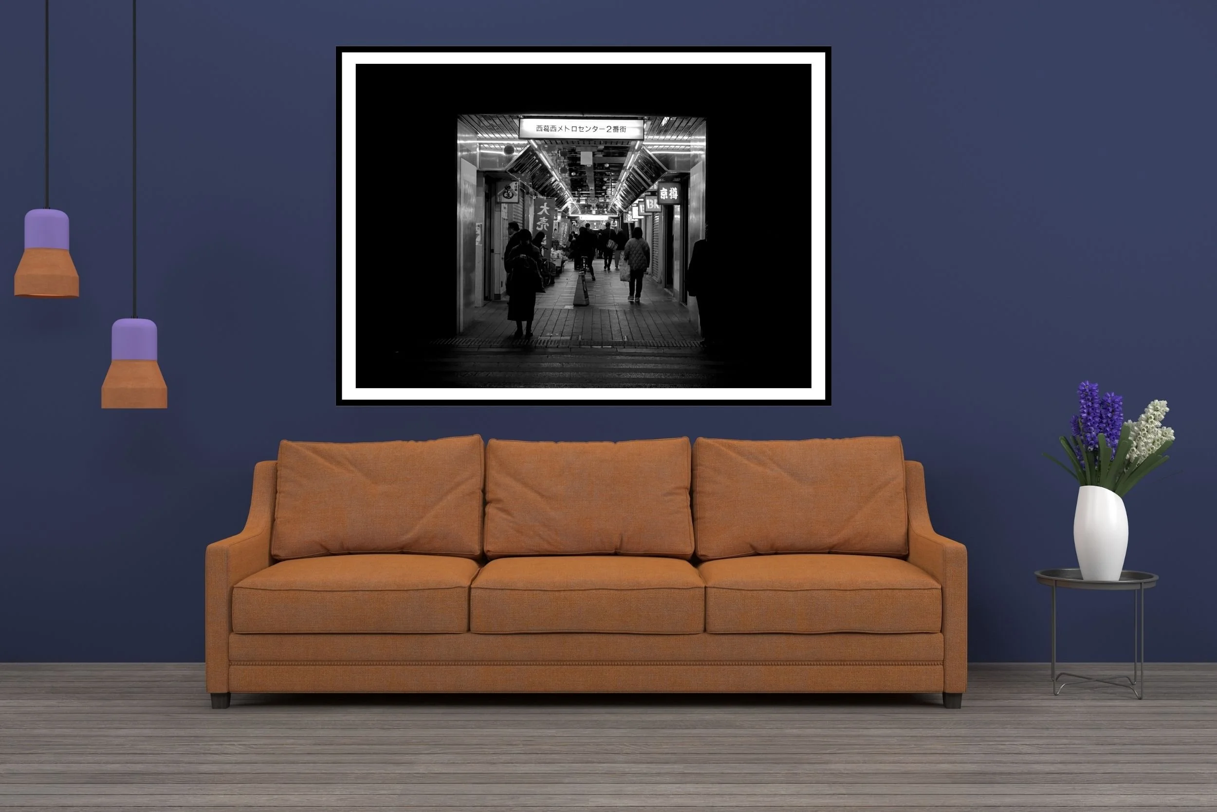 Black and white street photo of shoppers waiting at the dark end of a shopping strip in Nishikasai in Tokyo