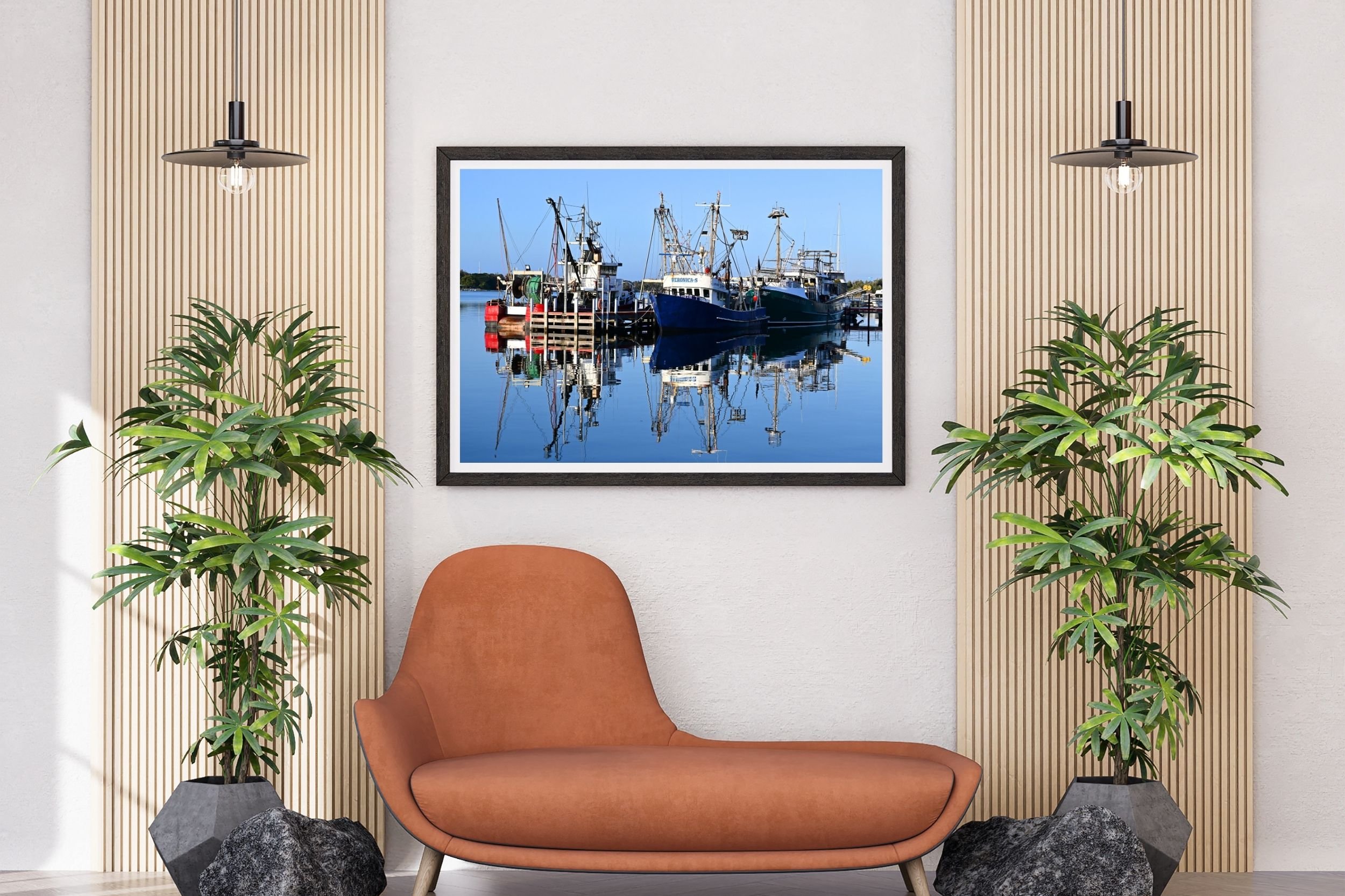 A serene sunlit harbour scene featuring fishing boats and mirror-like reflections on calm water at Lakes Entrance, Victoria Australia.