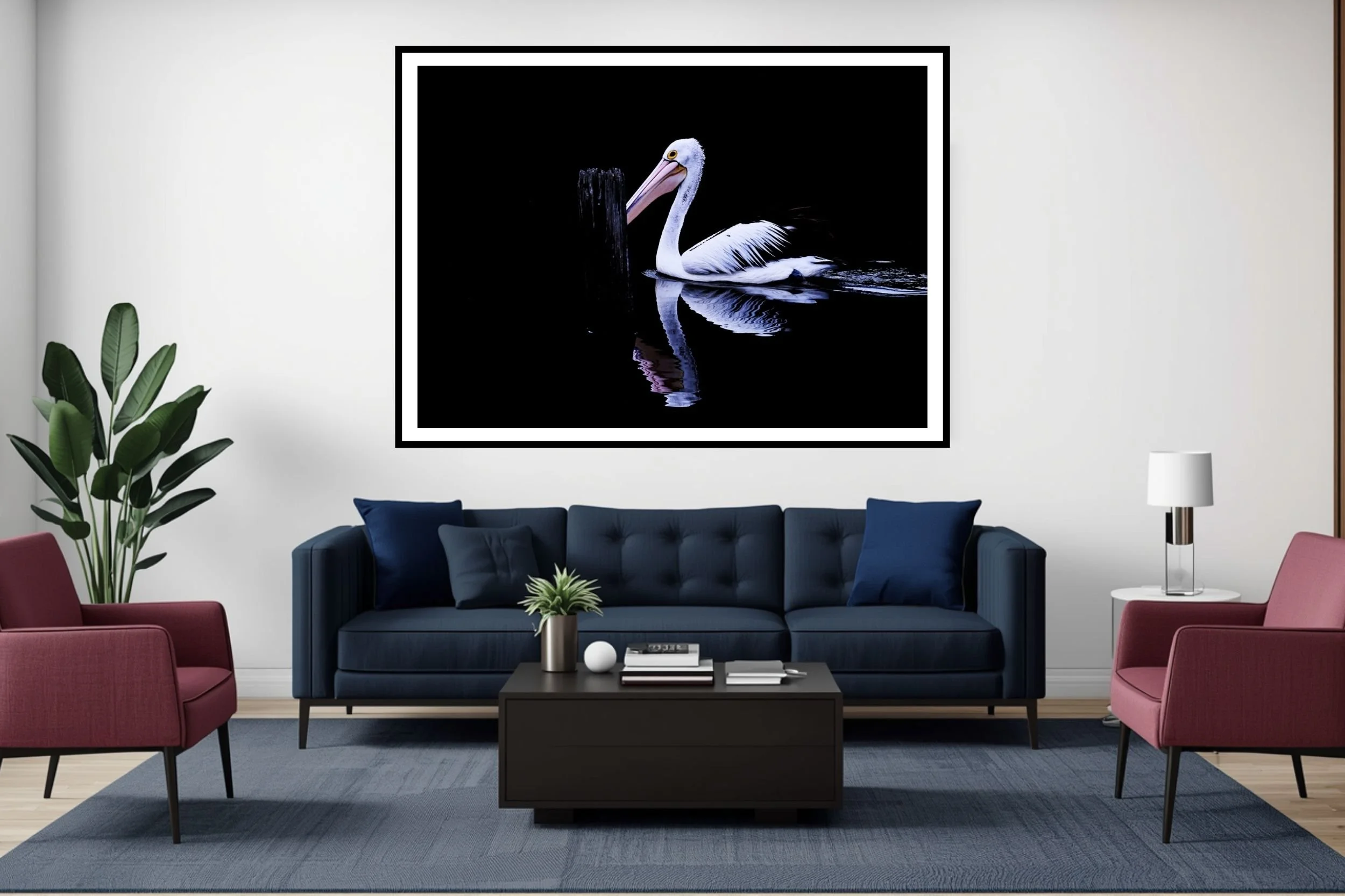 A striking minimalist photograph of a black and white Pelican set against a deep black background