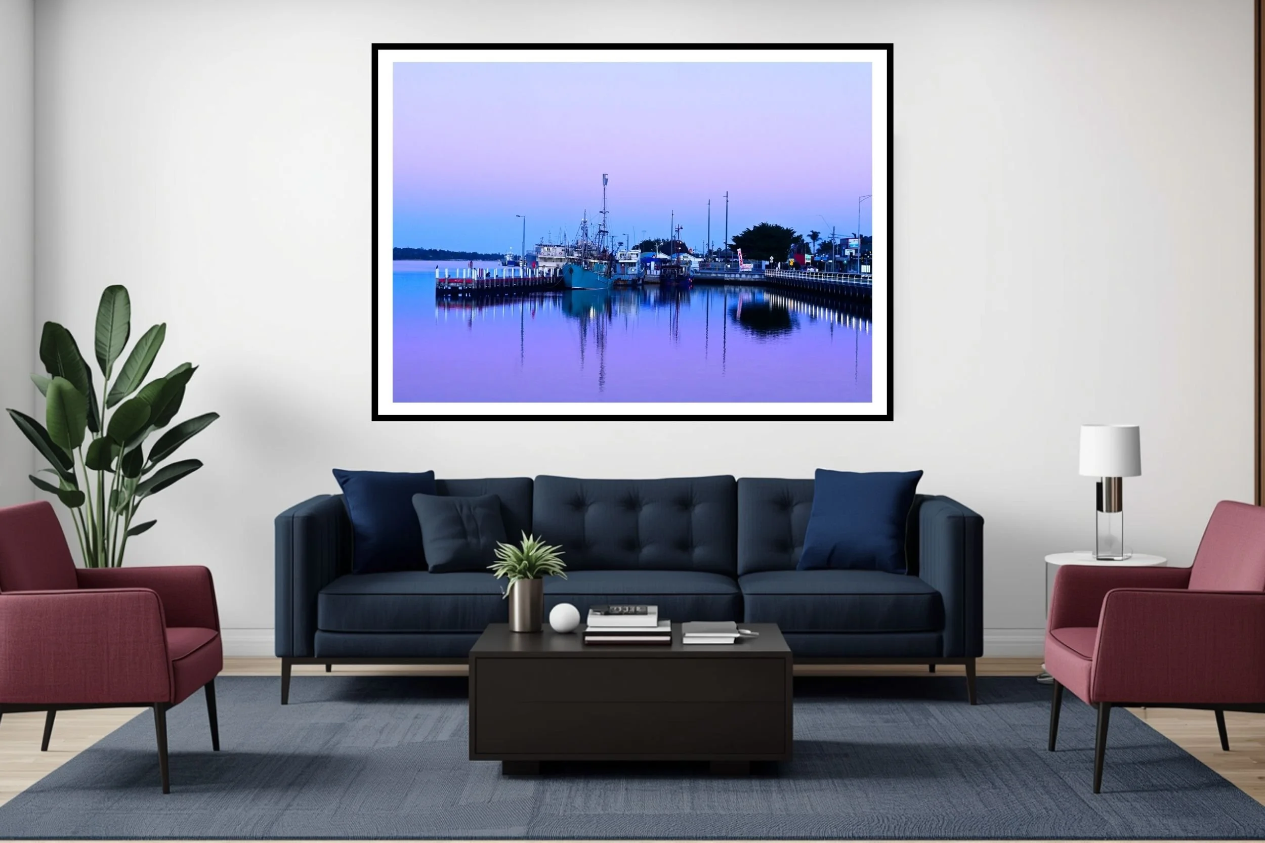 A serene blue hour harbour scene featuring fishing boats and mirror-like reflections on calm water in Lakes Entrance Australia.