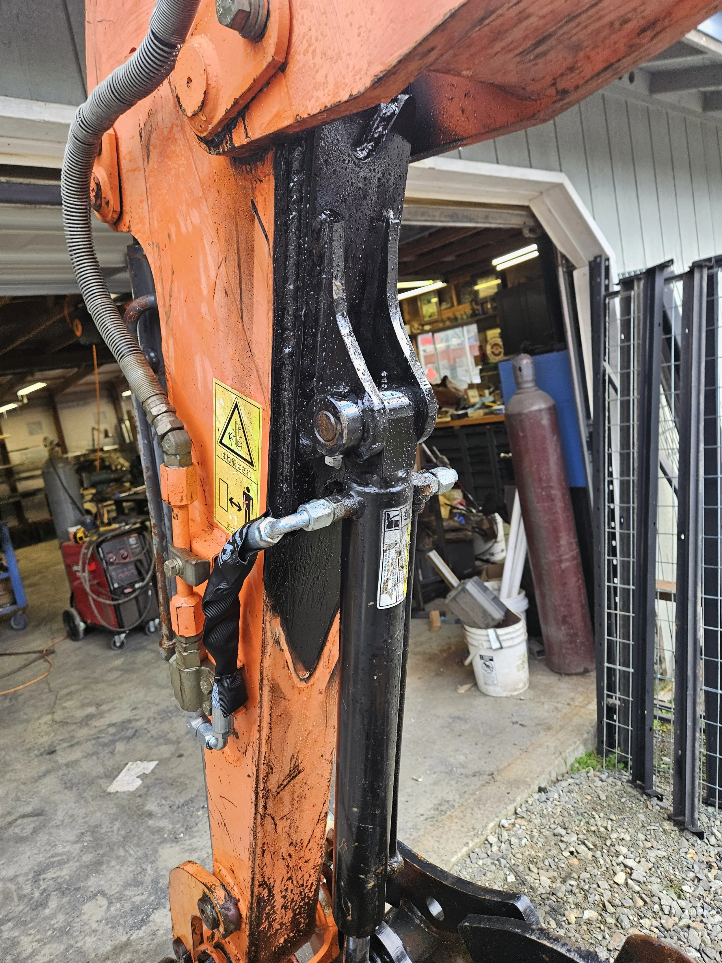 Custom skid steer attachment fabricated by A&J Custom Metals in Graham WA