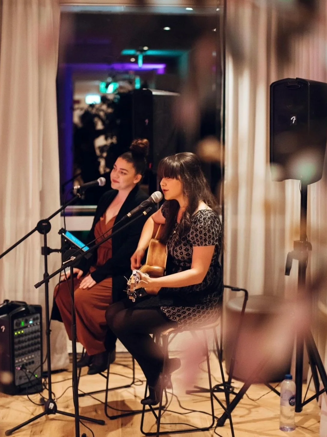 Dayna & Rosie from Azura Music performing at a corporate event in Sydney Harbour.