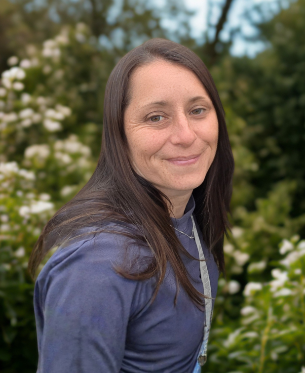 A woman with brown hair and smiling