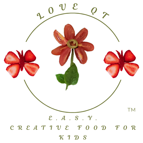 Love QT's logo with the text 'Love QT' at the top and 'Creative Food for Kids' at the bottom, featuring a center flower made of cherry tomato slices with green olive slice and a green basil stem, surrounded by two butterflies made from strawberries.