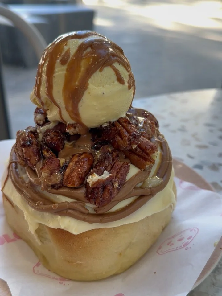 Meet our June Special: Candied Maple Walnut Caramel Scroll 🤎

Freshly baked, topped with a scoop of creamy vanilla gelato, and finished with warm hot caramel sauce poured over the top for the ultimate dessert experience.

Sweet, sticky, crunchy, and